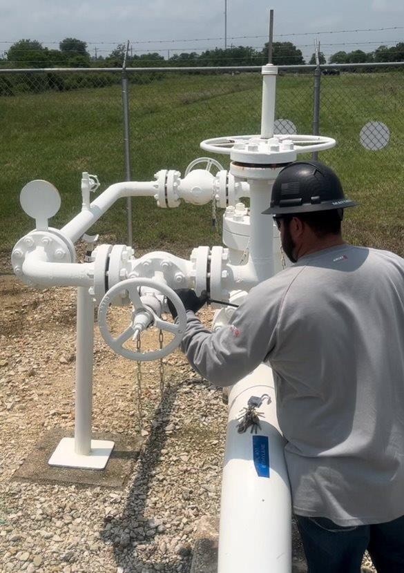 A man maintains one of Motiva's pipelines.