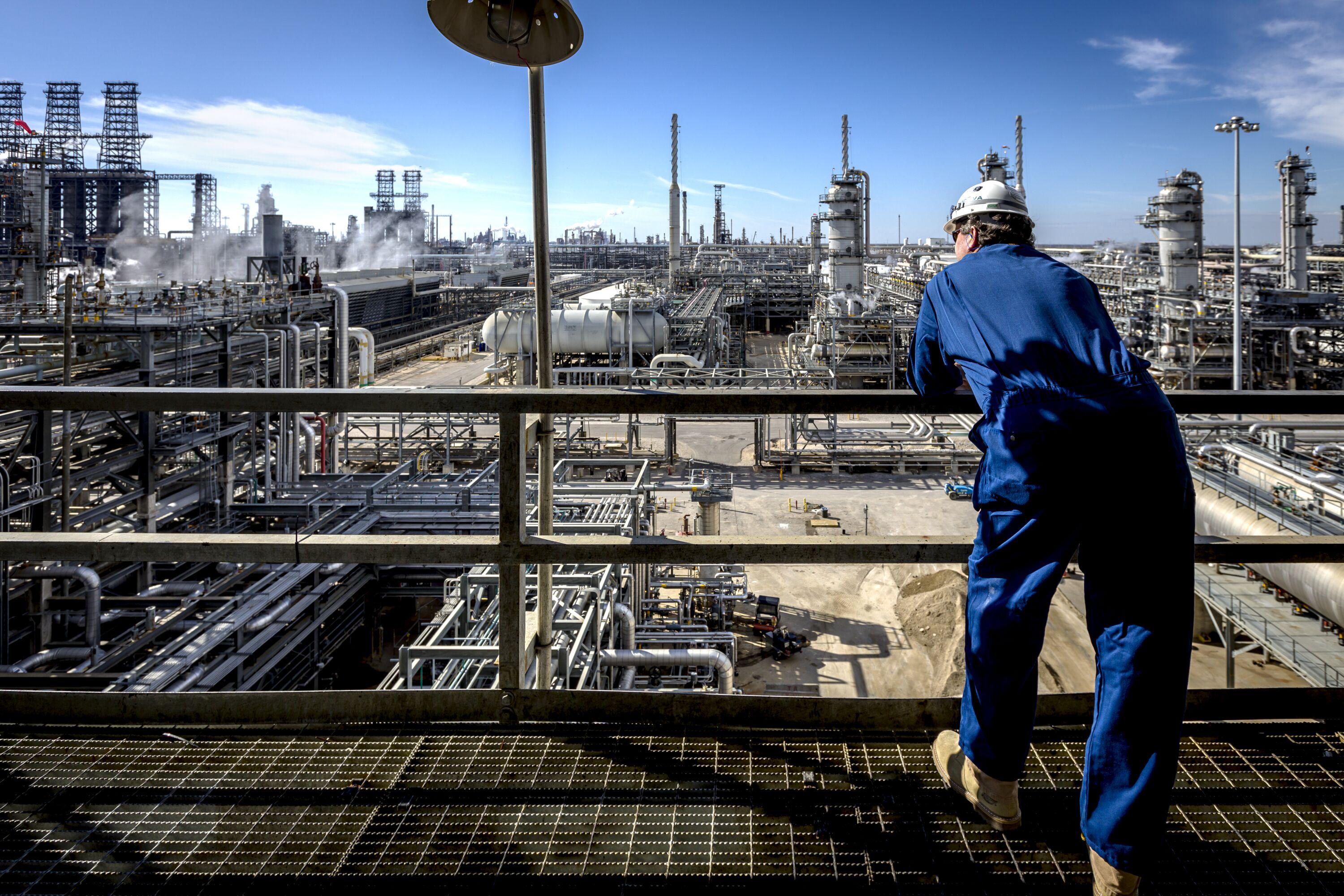 Man looking out from base oils unit at Motiva's refinery.