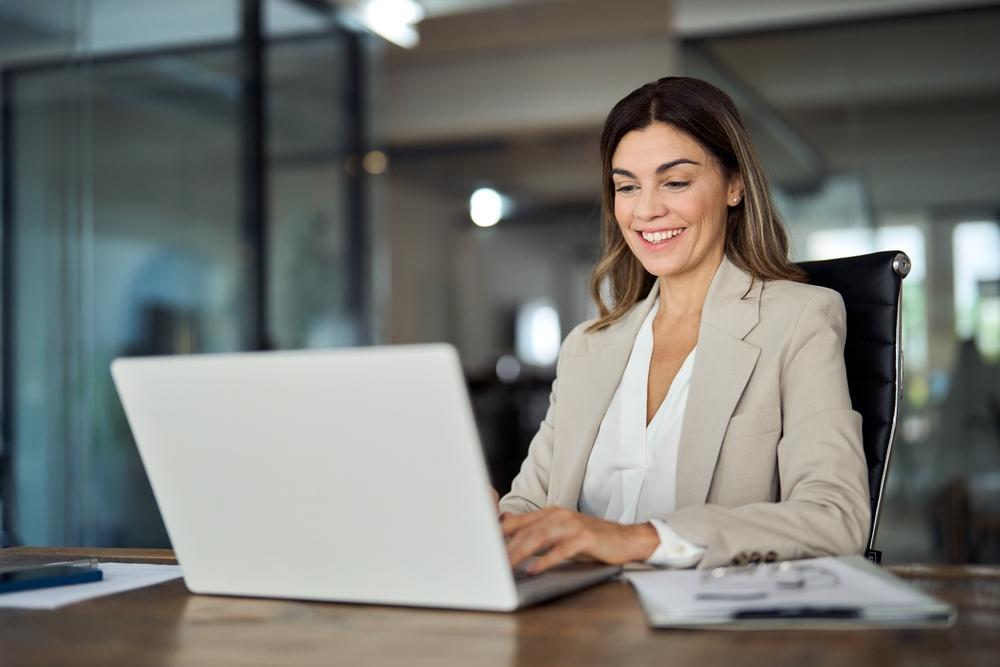 Woman smiling at computer